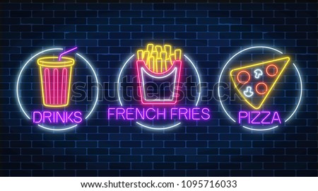 Set of three neon glowing signs of french fries, piece of pizza and soda drink in circle frames on a dark brick wall background. Fastfood light billboard symbol. Cafe menu item. Vector illustration.