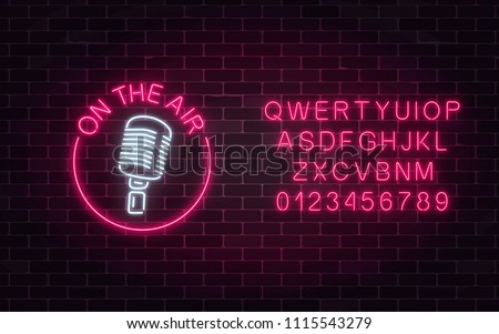 Neon on the air sign with retro microphone in round frame with alphabet. Nightclub with live music icon. Glowing signboard of radio station. Sound cafe icon. Music show poster. Vector illustration.