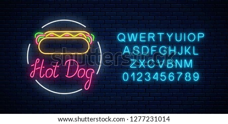 Neon hot dog cafe glowing signboard with alphabet on a dark brick wall background. Fastfood light billboard sign. Vector illustration.