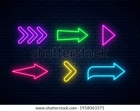 Neon arrow signs collection. Bright arrow pointer symbols. Set of colorful neon arrows, web icons on brick wall background. Banner design, bright advertising signboard elements. Vector illustration.