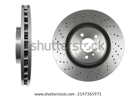 Car brake disc isolated on white background. Auto spare parts. Perforated brake disc rotor isolated on white. Braking ventilated discs. Quality spare parts for car service or maintenance 商業照片 © 
