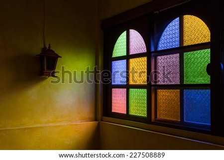Colorful window glass in the old hotel of the north of Thailand. Art idea by the owner, there are in the old building, it was replaced from old wood window to let sunshine through inside.