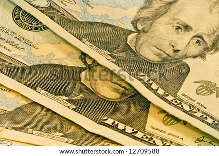 Close up of three american twenty dollar bills showing Andrew Jackson