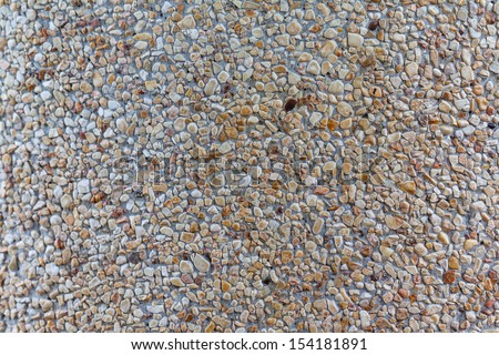 Background of concrete mixed with small stone chippings.