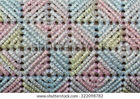 Texture of colorful cross stitch in woman bag