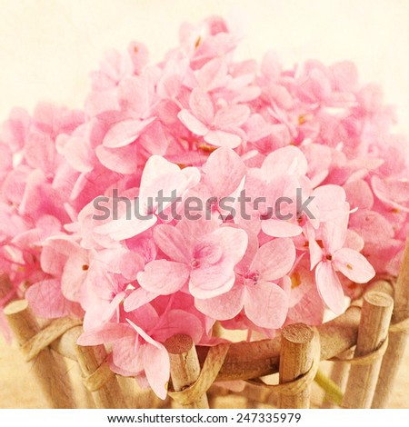 Sweet Pink Hydrangeas in basket on mulberry paper texture