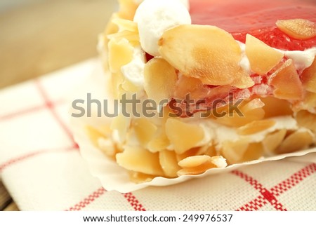 strawberries jam cake with almonds slices