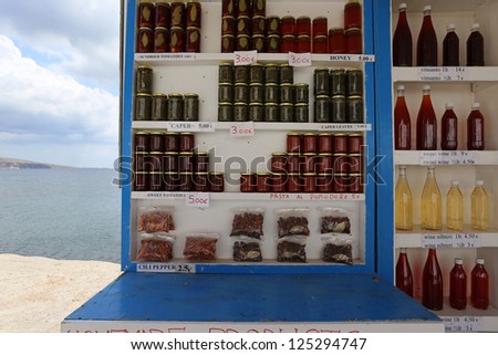 A small kiosk on the beach in Santorini, Greece. Selling Homemade, Honey, Wine capers.