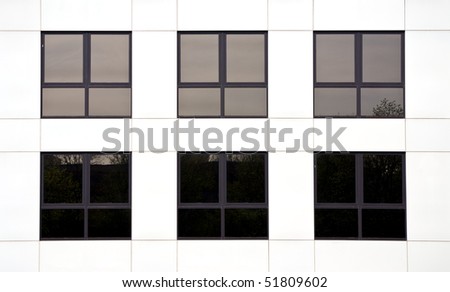 Six windows in an office block of a white office