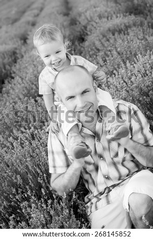 happy dad with baby son in lavender field  ( black and white )