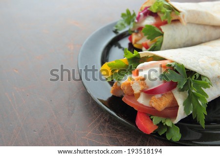 Tortilla wraps with fresh chicken and vegetables