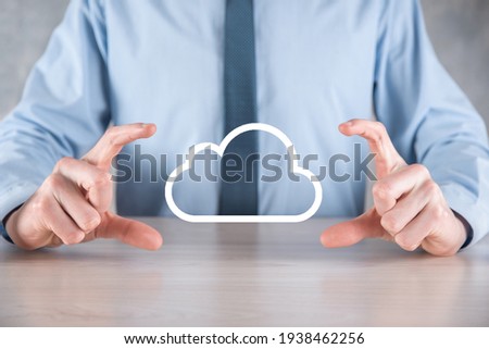 Businessman hand holding cloud.Cloud computing concept, close up of young business man with cloud over his hand.The concept of cloud service