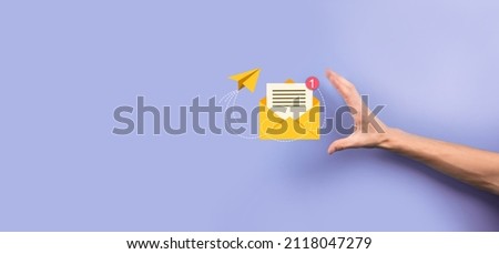 Businessman hand holding letter icon,email icons.Contact us by newsletter email and protect your personal information from spam mail.Customer service call center contact us.Email marketing newsletter Imagine de stoc © 