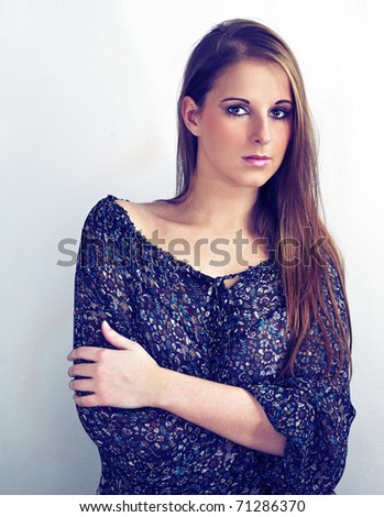 Girl posing in dark blouse