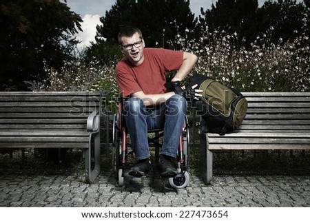 Young man on wheel chair - obstacles in life