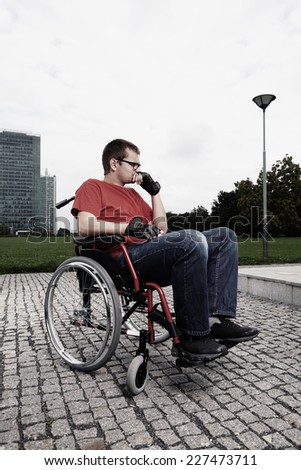 Relaxing of disabled man on wheel chair