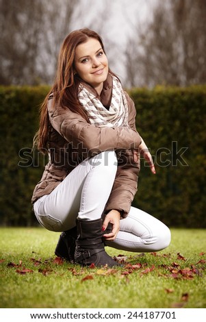 Nice young woman in house garden