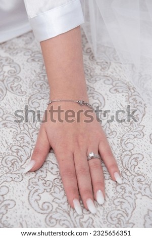 Similar – Image, Stock Photo Bride shows her beautiful lace wedding garter.