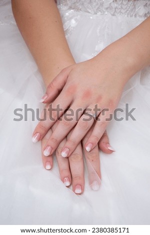 Similar – Image, Stock Photo Bride shows her beautiful lace wedding garter.