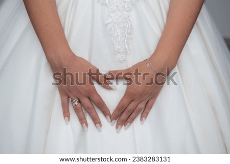Similar – Image, Stock Photo Bride shows her beautiful lace wedding garter.