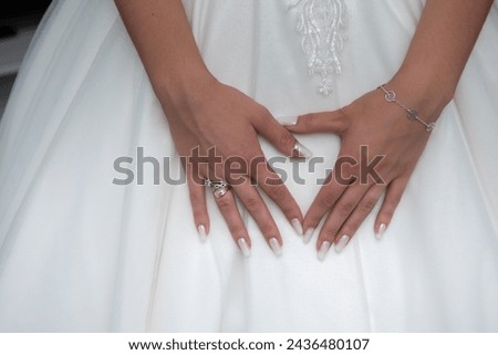 Similar – Image, Stock Photo Bride shows her beautiful lace wedding garter.