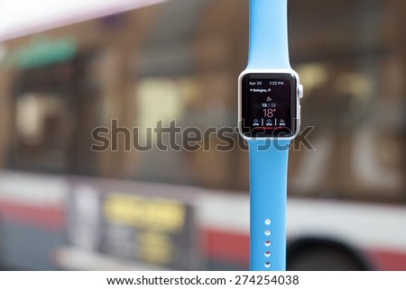BOLOGNA, ITALY - APR 30, 2015: the Apple Watch. The first wrist device produced by Apple. Screen displays the weather and temperature