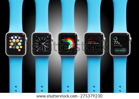 BOLOGNA, ITALY - APR 30, 2015: the Apple Watch. The first wrist device produced by Apple. Different screen samples displayed on black and white gradient background.