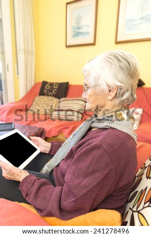 Grandma learning to use a tablet for business