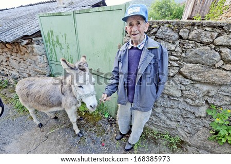 BRAJCINO, MACEDONIA, MAY 18, 2011. An old man with his donkey in the first eco village in Macedonia, in Brajcino, Macedonia, on May 18th, 2011.