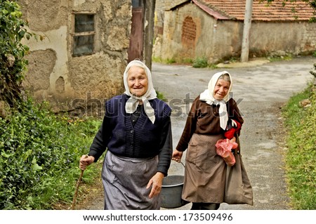 OHRID, MACEDONIA, MAY 17, 2011. Two old Macedonian ladies walking up the street in the countryside of Ohrid, Macedonia, on May 17th, 2011.