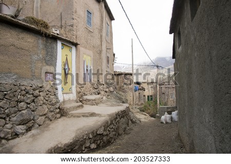 MOROCCO, MAY 13, 2014. The main street of an old primitive village in the Atlas mountains of Morocco, on May 13th, 2014.
