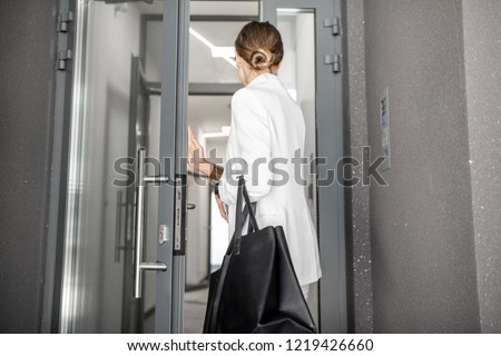 Similar – Image, Stock Photo A young woman leaving the airport with her luggage at her destination