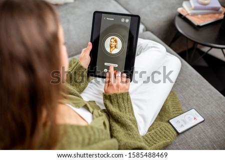 Similar – Image, Stock Photo Young woman making video call sending greetings from vacation trip in mountains. Woman with backpack hiking through tall grass along path on meadow