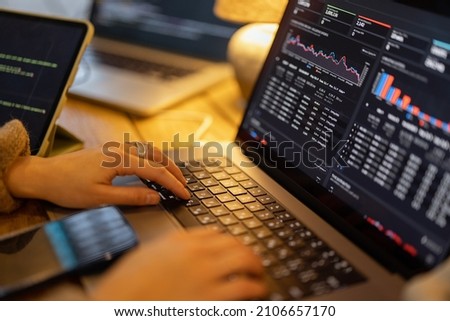 Woman working on some programming dashboard on laptop, close-up on hands and keyboard. Programmer, software tester or analyst working online Photo stock © 