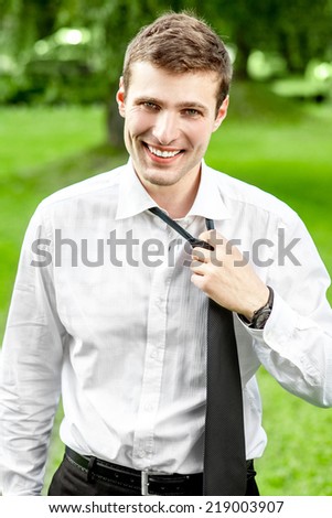Businessman tired after work in the park