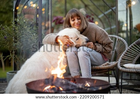 Image, Stock Photo fire in the garden	fireplace made of old metal barrel