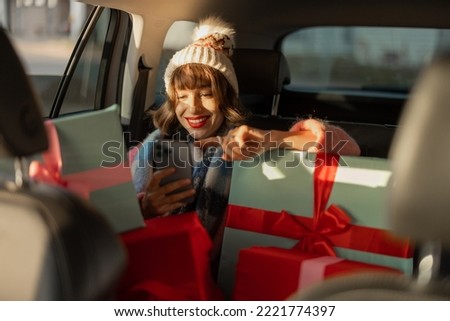 Similar – Image, Stock Photo Woman dressed in red using the mobile on a blue background. Concept of using the mobile. Blue background.