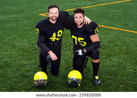 Friendly american football players together on the sports ground