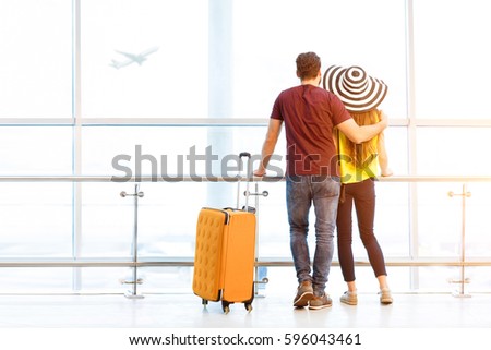 Similar – Image, Stock Photo young woman with luggage arrives at the train station by cab