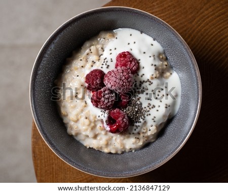 Similar – Image, Stock Photo Hot porridge with frozen blueberries