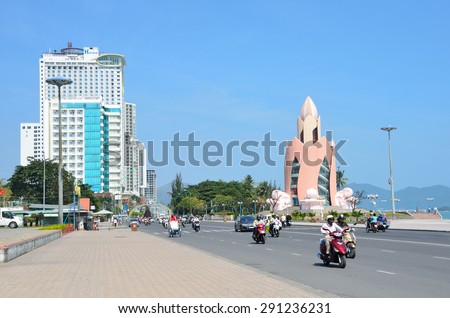 Nha Trang, Vietnam, January, 25, 2015, Vietnamese scene: People on mopeds, motorcycles and cars on the embankmant of Nha Trang