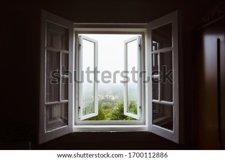 Wide open window with amazing countryside view on foggy day. Stay home concept. Scenery view from the house. Travel to Spain and holidays concept. Open a window to air the room. Ventilate your house. Imagine de stoc © 