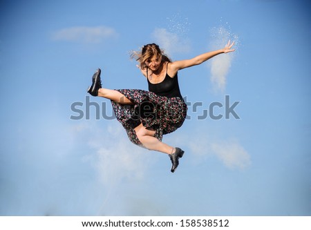 Portrait of jumping tap dancer girl.