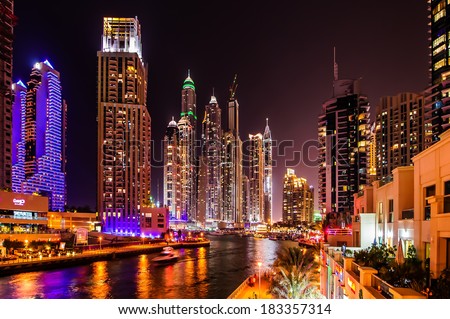 DUBAI, UAE - MARCH 21: Dubai Marina at dusk  March 21, 2014, Dubai, UAE. In the city of artificial channel length of 3 kilometers along the Persian Gulf.