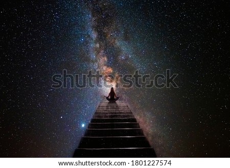 Woman in yoga pose at top of stair