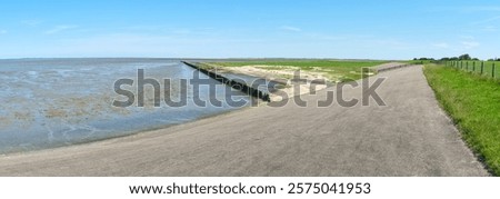 Similar – Image, Stock Photo The Wadden Sea World Heritage Site with coastal protection on the coast of the North Sea at the harbor of Norden near Norddeich in East Frisia in Lower Saxony, photographed in classic black and white