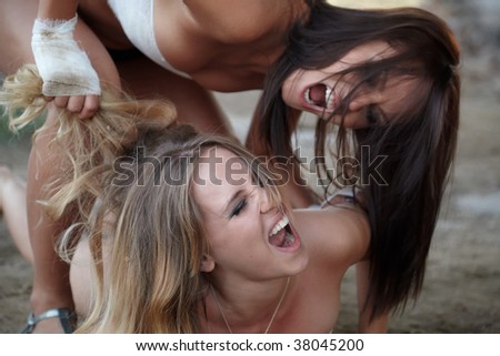 Two young womans fight  (picture not life - play)