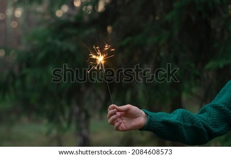 Similar – Foto Bild Wunderkerze in Frauenhand mit rotem Nagellack