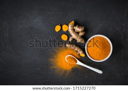 Similar – Image, Stock Photo Turmeric roots and powder in a white bowl on a grey wooden table. Close up. Spice.