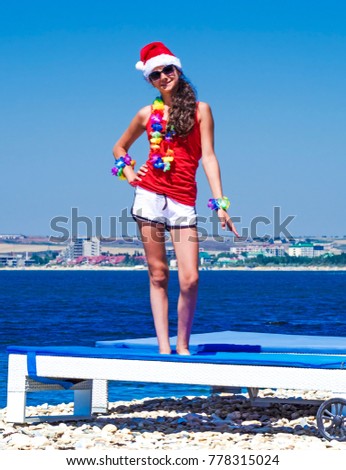 Similar – Image, Stock Photo woman in a Santa hat with lighted sparklers on the background of a New Year or Christmas tree decorated with red ball.